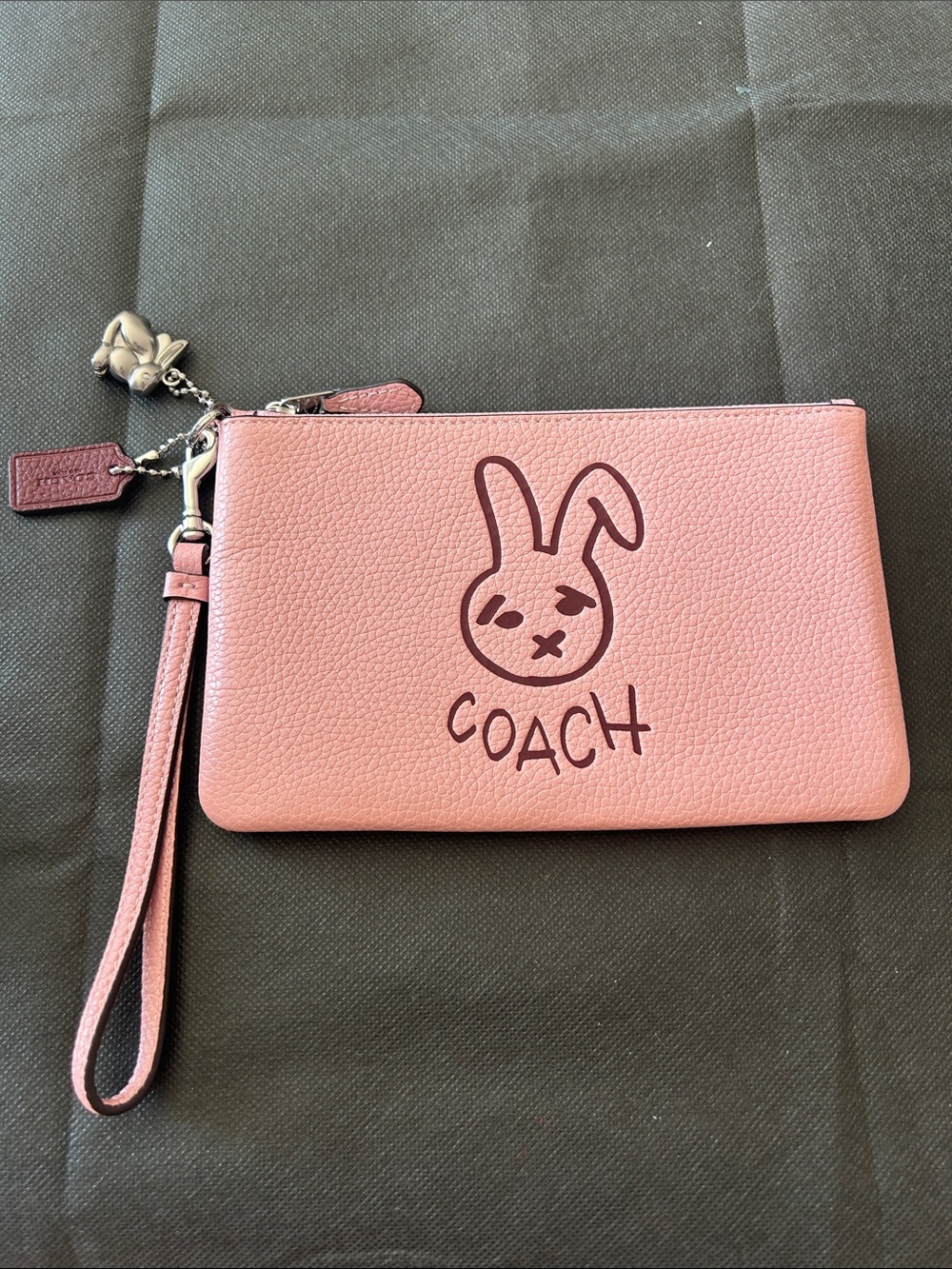 Coach Pink Pebbled Leather Wristlet with Bunny Sketch